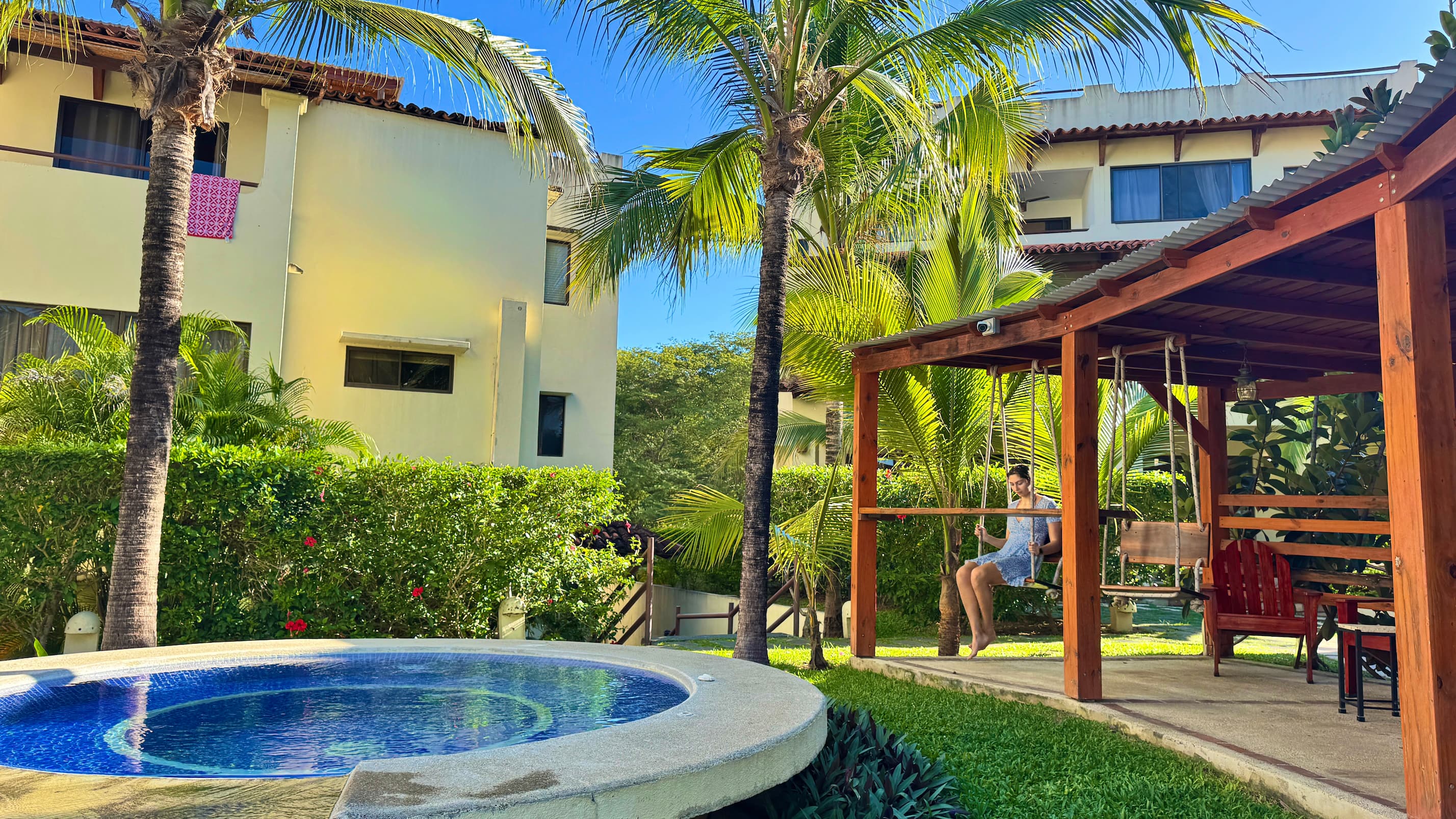 Coco Sunset Hills - Central pool's patio area with swings