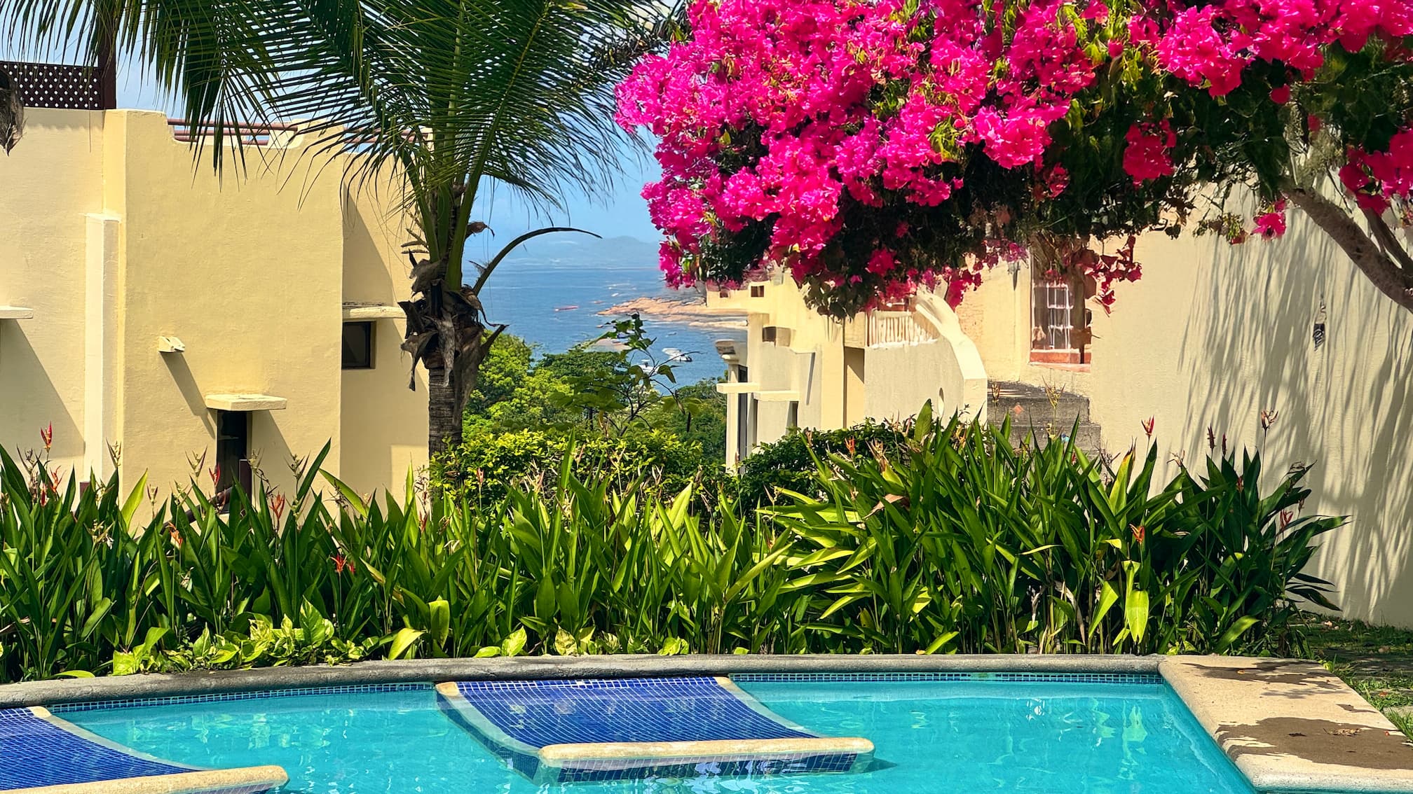 Coco Sunset Hills - central pool with an ocean view